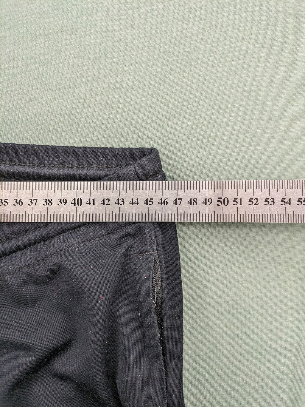 Jako black training pants size L with zippered pockets and elastic waistband.