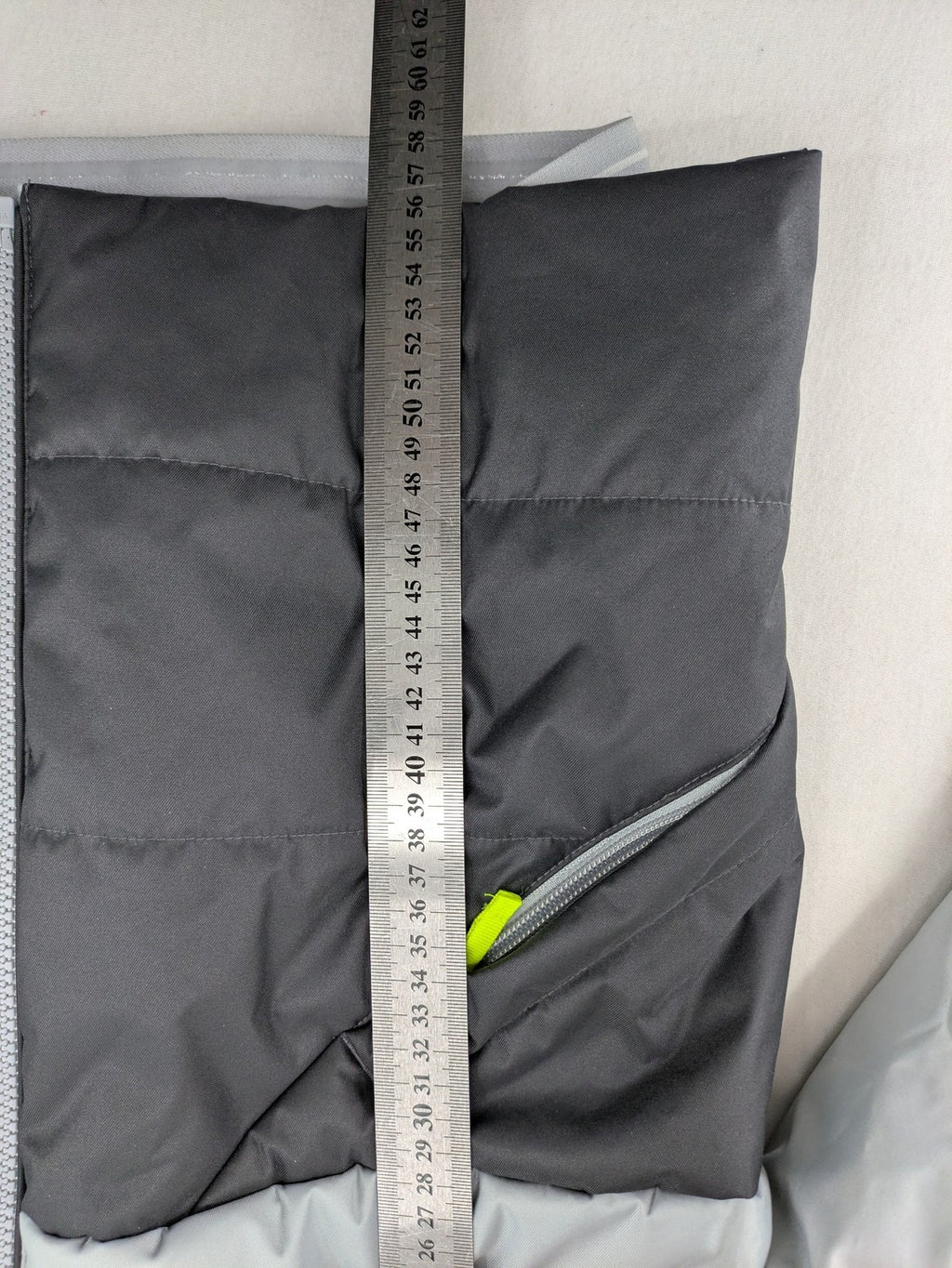 Wedze ski coat grey and black colorblock design with neon accents and fleece lining.