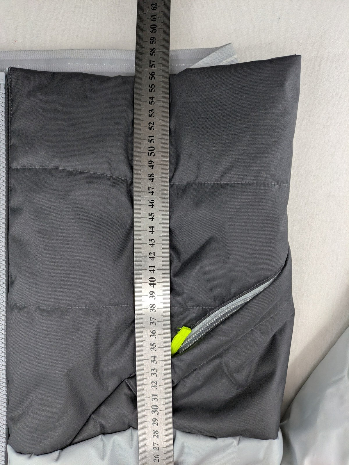 Wedze ski coat grey and black colorblock design with neon accents and fleece lining.