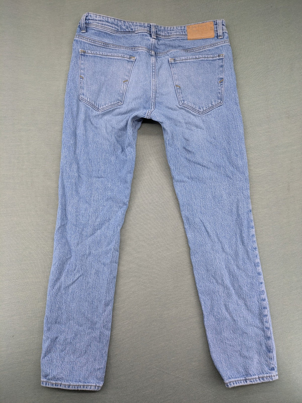 Selected Homme blue slim fit jeans with classic wash and stretch cotton material.