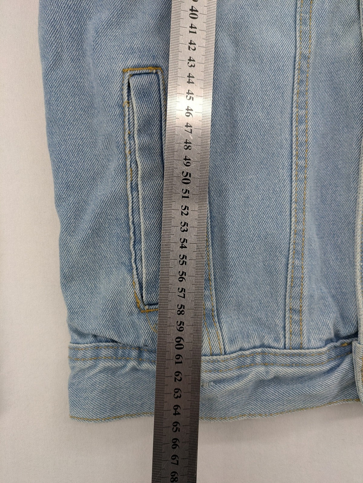 Zara Man blue denim jacket distressed with button closure and chest pockets.