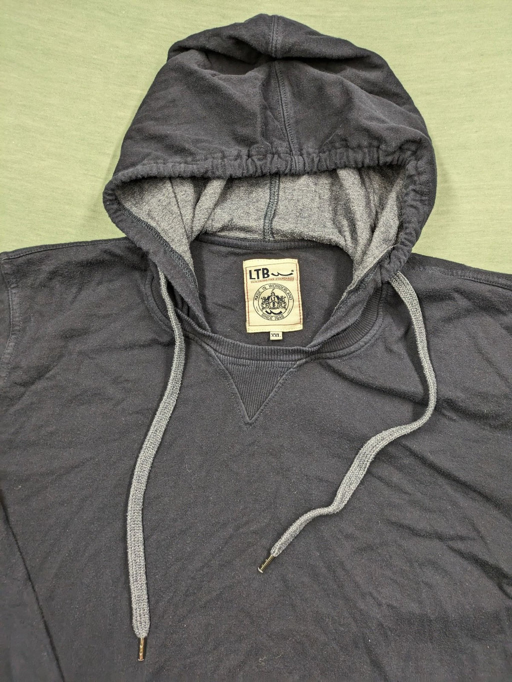 LTB black faded hoodie with adjustable drawstring and embroidered logo on sleeve.