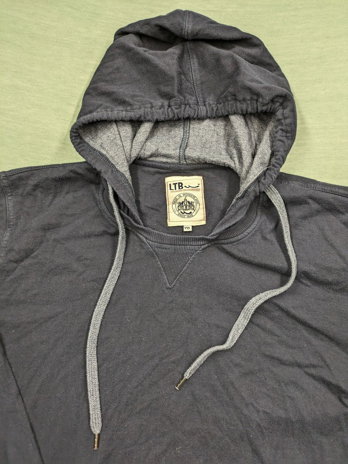 LTB black faded hoodie with adjustable drawstring and embroidered logo on sleeve.