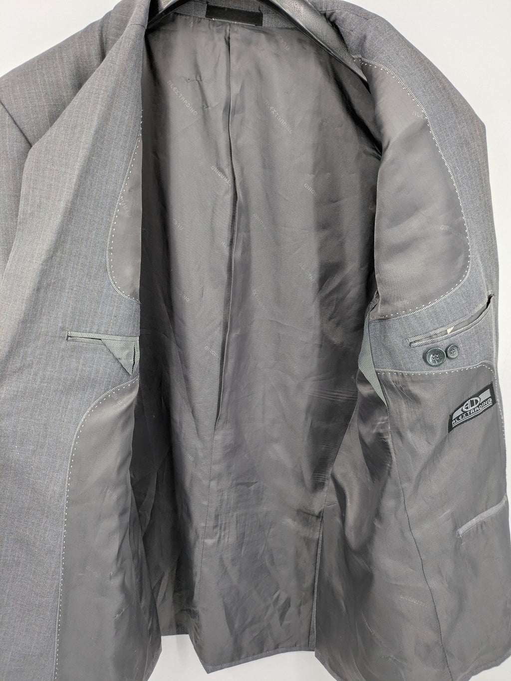 Alextrading grey jacket with subtle light blue pinstripe pattern and notch lapels.