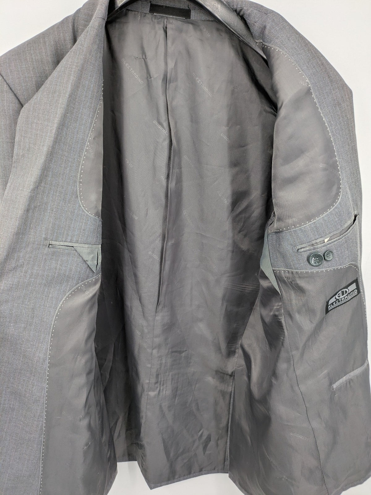 Alextrading grey jacket with subtle light blue pinstripe pattern and notch lapels.