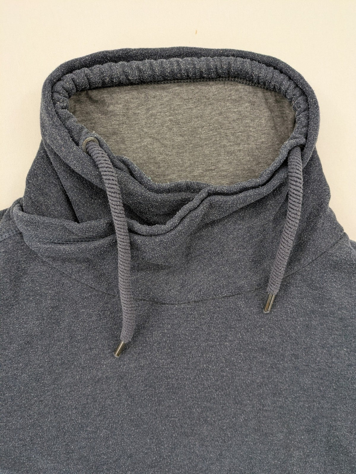 s.Oliver green turtle neck sweatshirt with adjustable drawstrings and graphic detail on sleeve