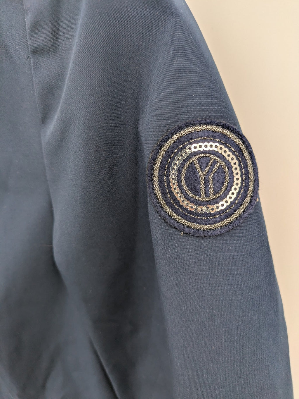 everYou navy parka jacket with hood, adjustable drawstring, patterned lining, button closure.