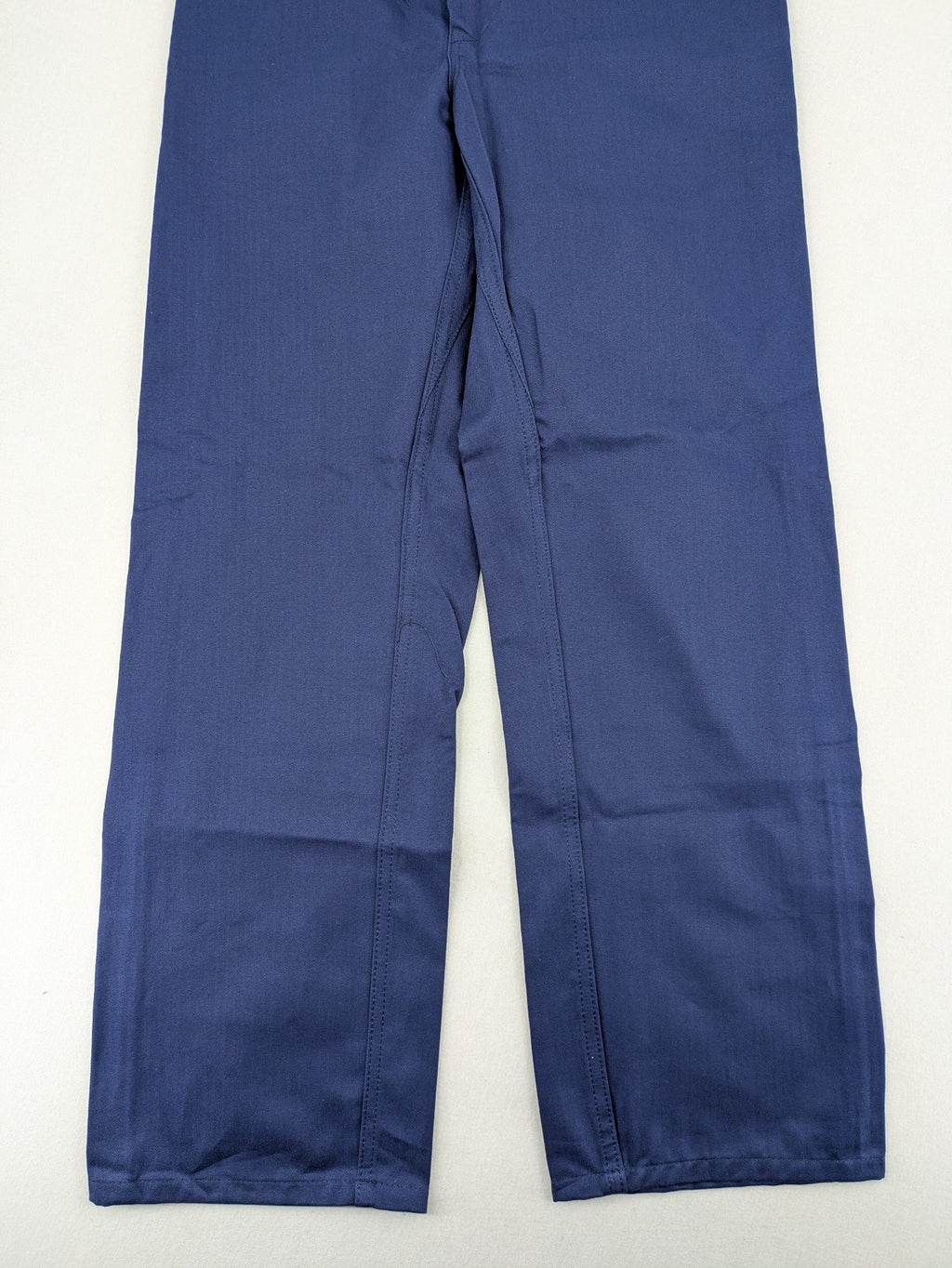 Uvex navy work trousers 100% cotton with button closure and belt loops.