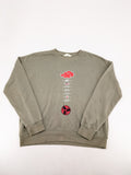 Naruto khaki turtle neck jumper featuring red Akatsuki cloud and Sharingan symbols.