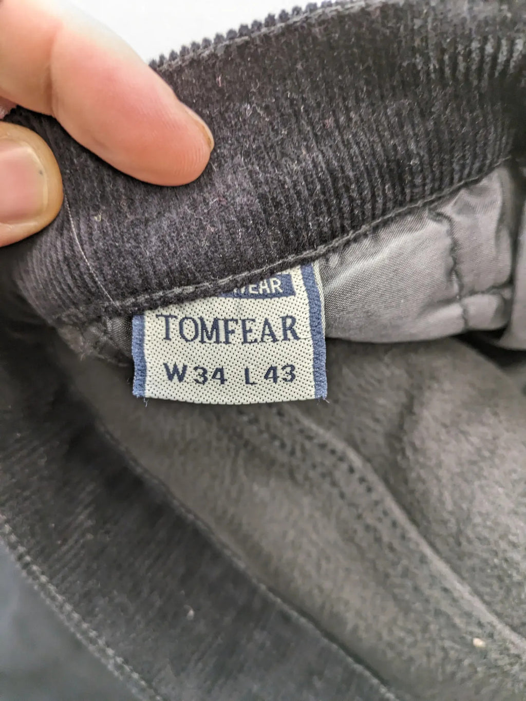 Tomfear black straight fit cord jeans, classic five-pocket design, soft corduroy material.