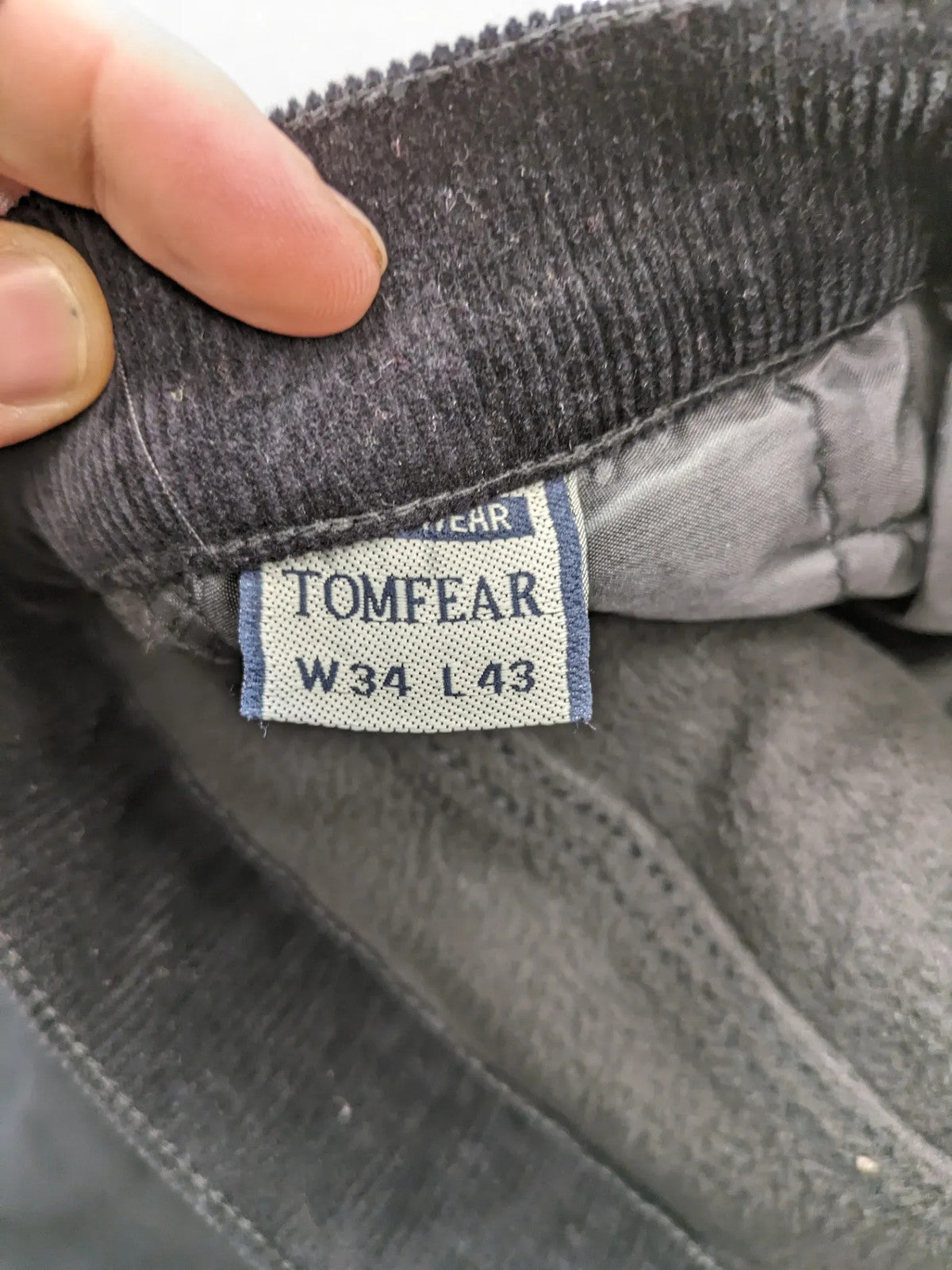 Tomfear black straight fit cord jeans, classic five-pocket design, soft corduroy material.