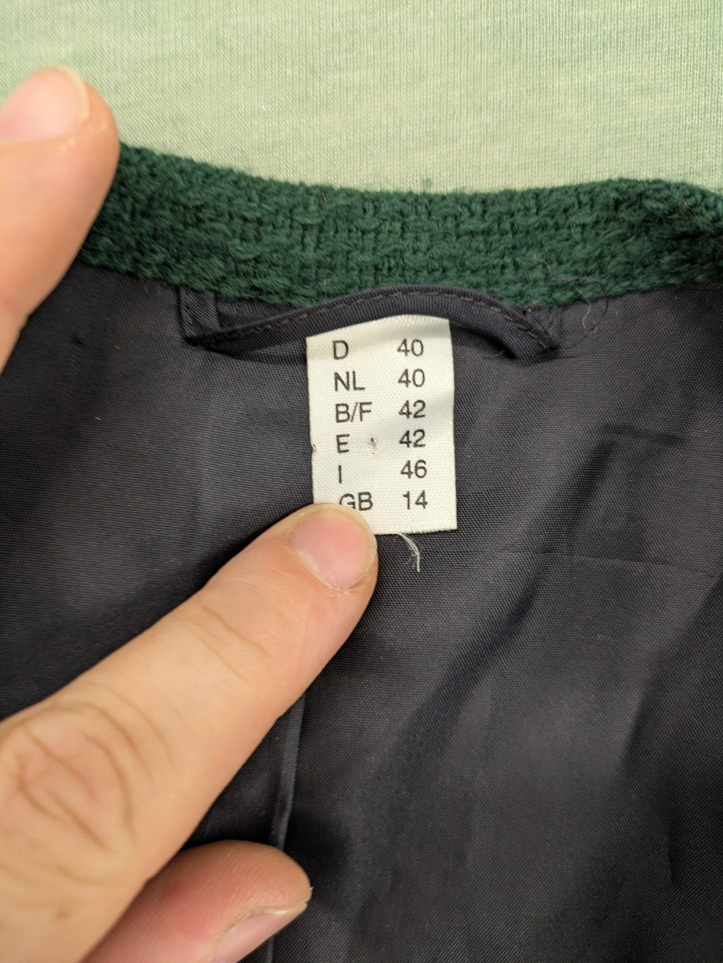 Blazer green and navy jacket with embroidered details and silver buttons.
