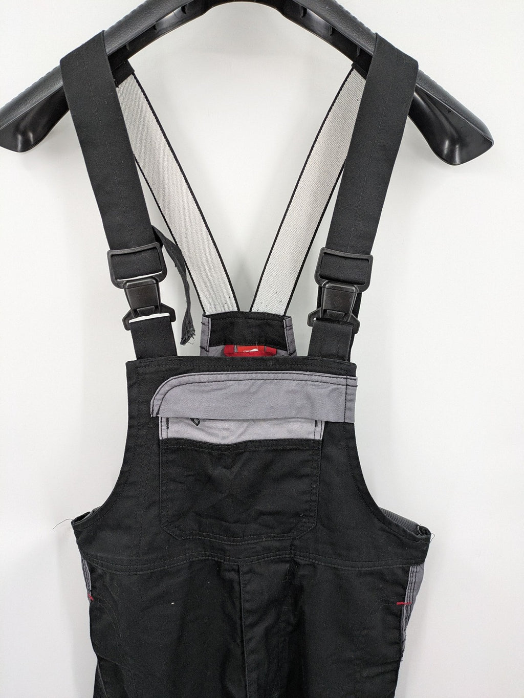 Cargo pants black grey two-tone design with red stitching and multiple pockets