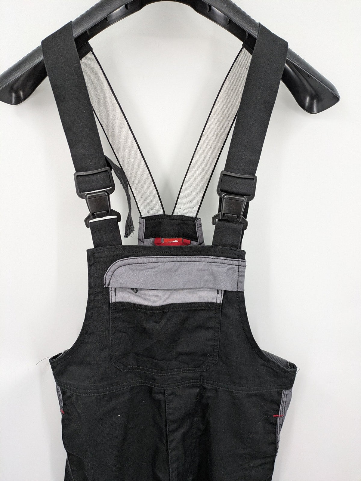 Cargo pants black grey two-tone design with red stitching and multiple pockets