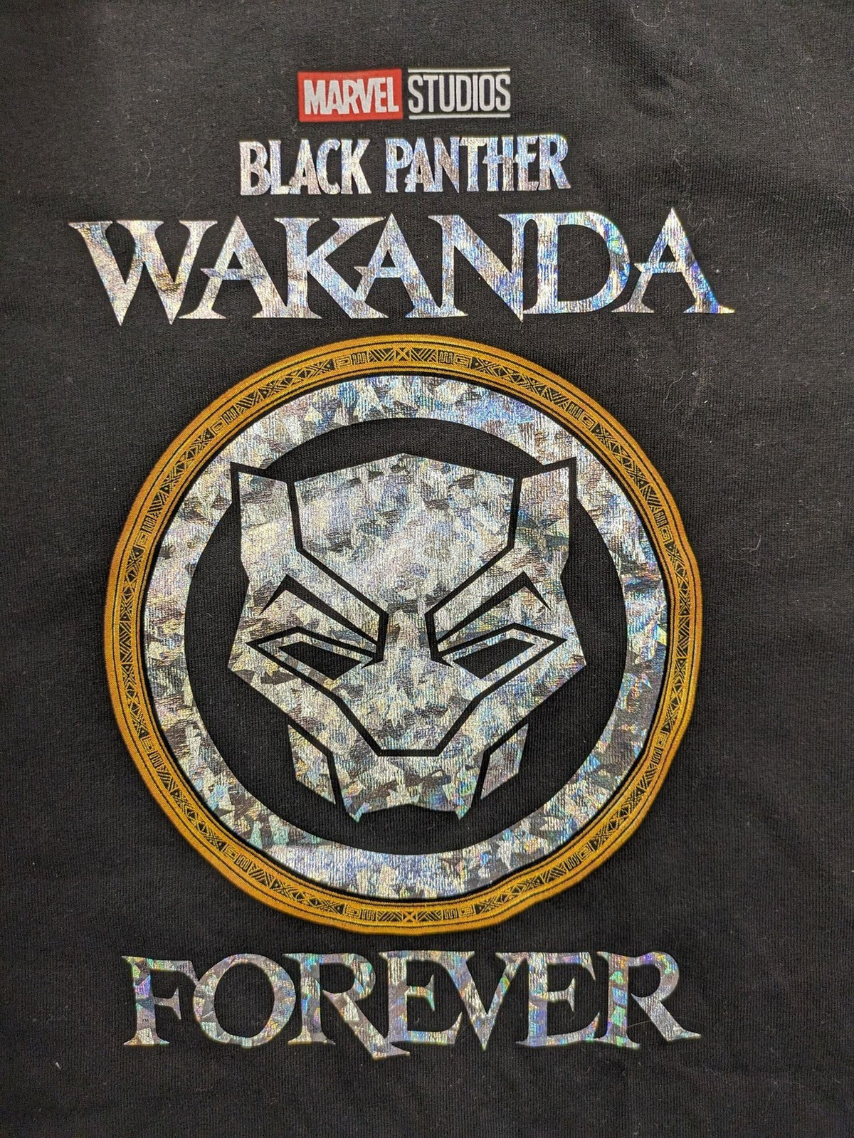 Black Panther black t-shirt foil graphic of Black Panther emblem and text.
