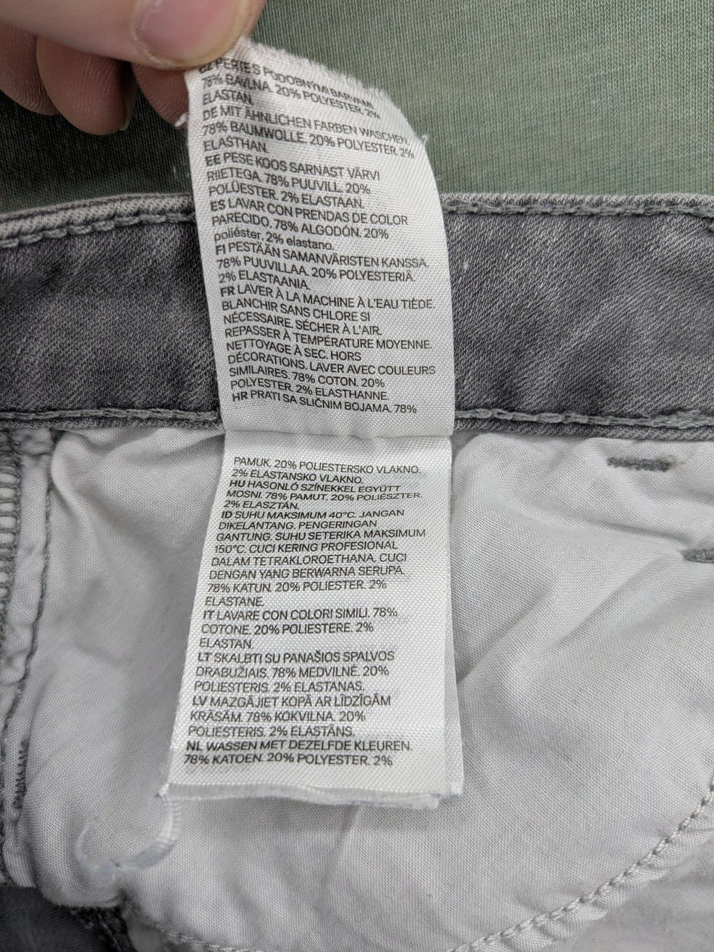 H&M grey super skinny jeans with distressed knee details and low waist fit.