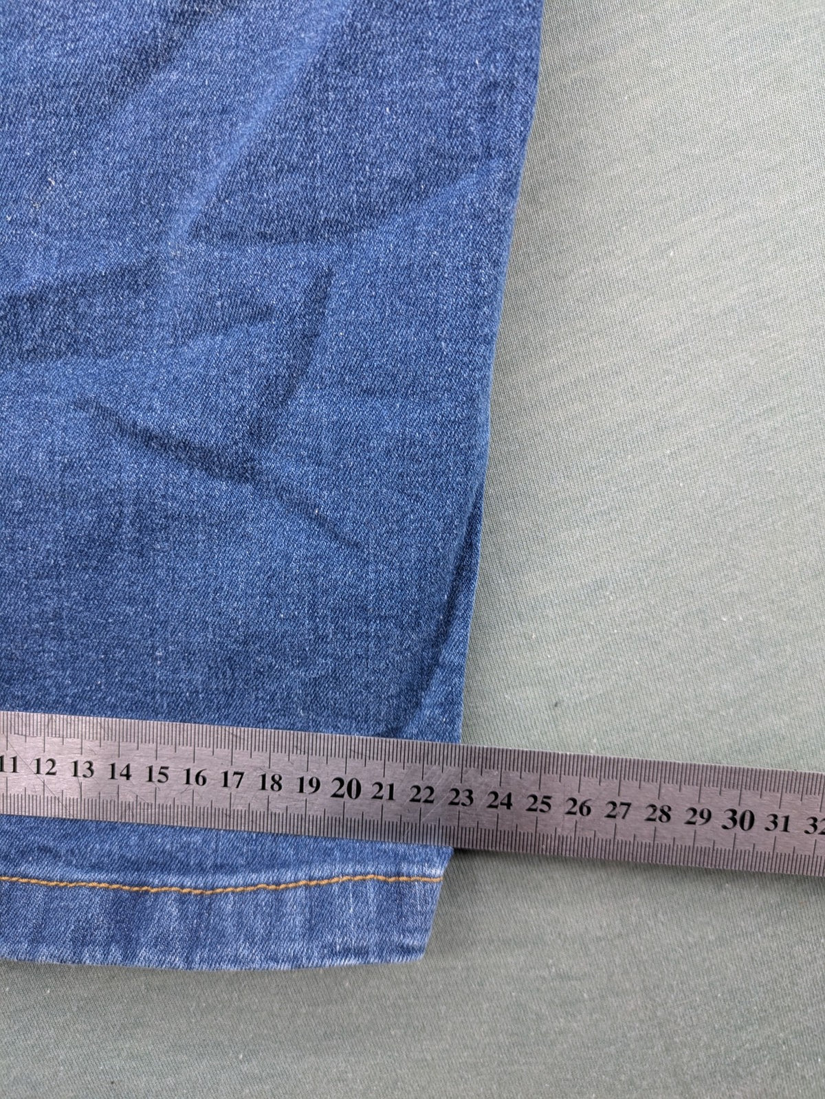 Bench blue straight jeans with reinforced knees and multiple cargo pockets.