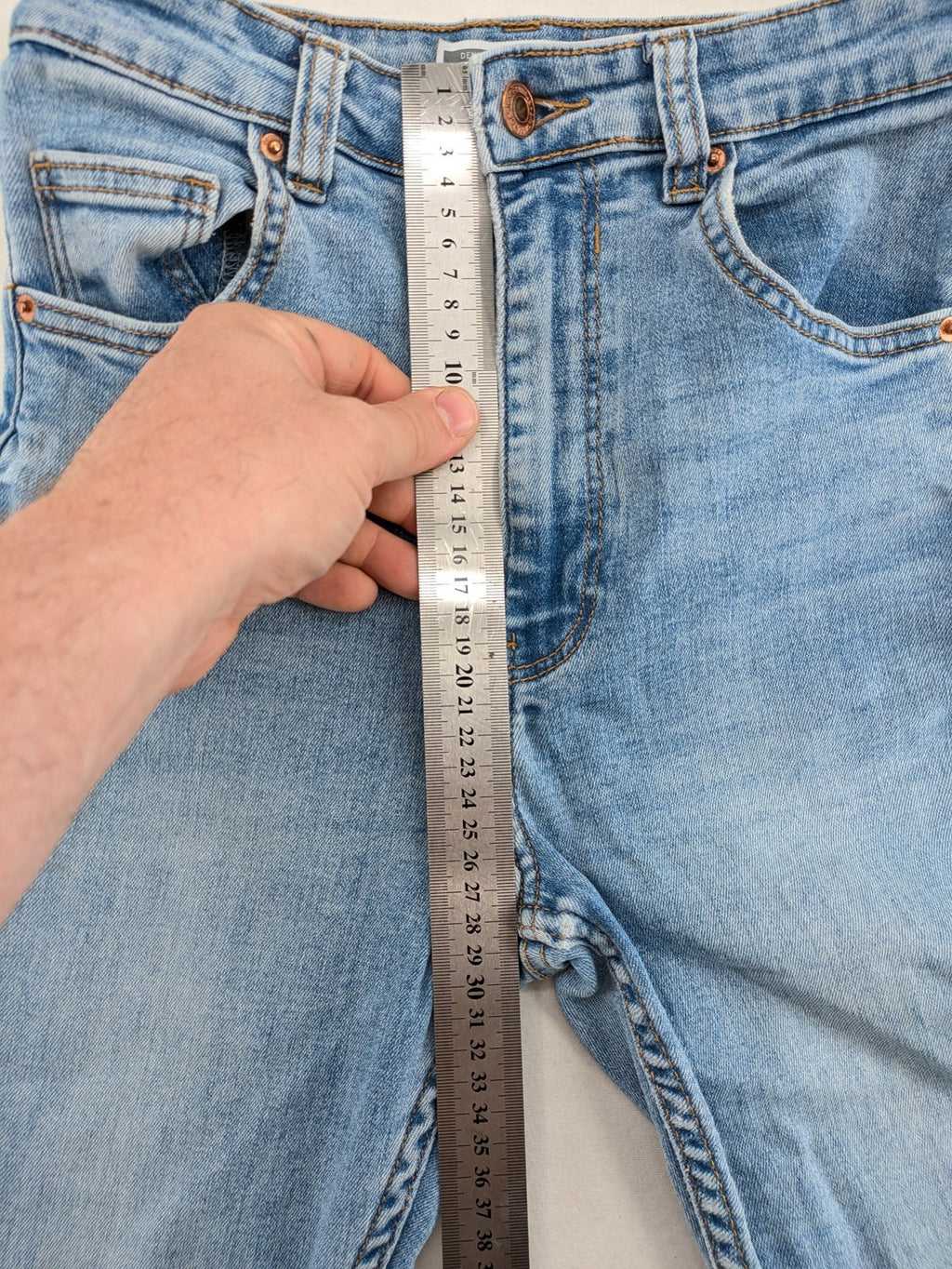 Bershka blue super high waist skinny jeans with washed denim finish and zip closure.