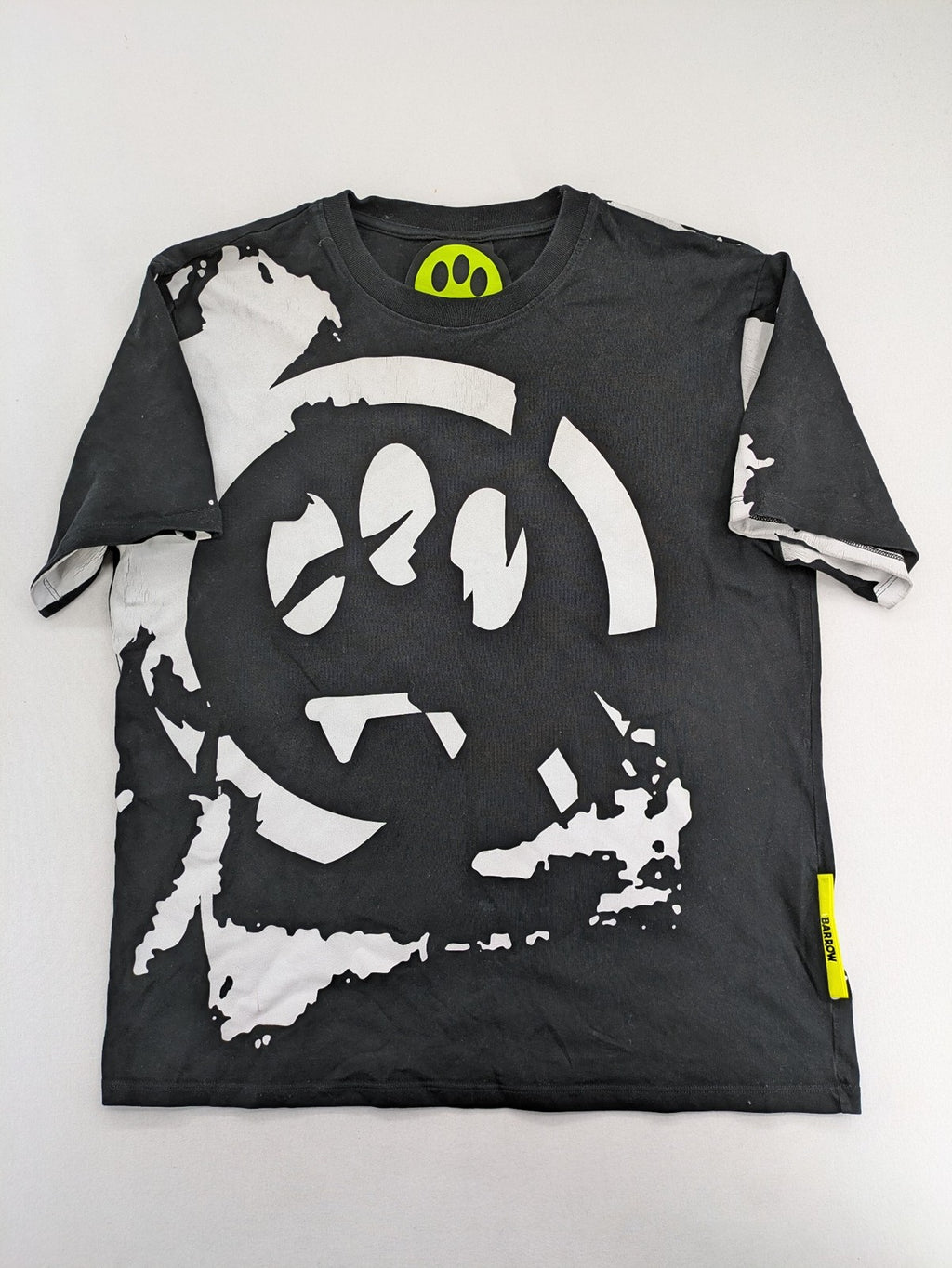 Barrow grey t-shirt with large black and white smiley graphic print and logo patch.