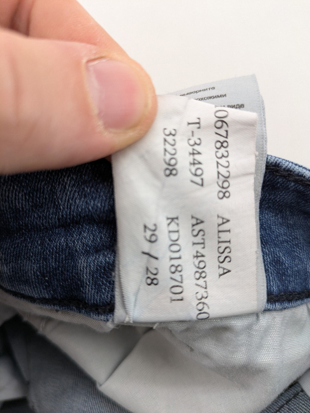 Mavi blue high rise super skinny jeans with medium wash and stretch denim material.