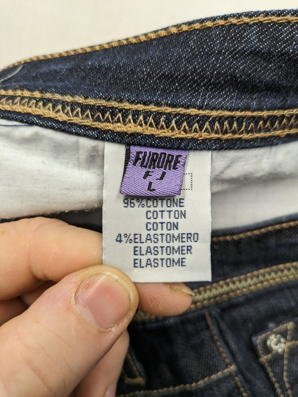 Furore blue straight jeans with yellow contrast stitching and zipper details.