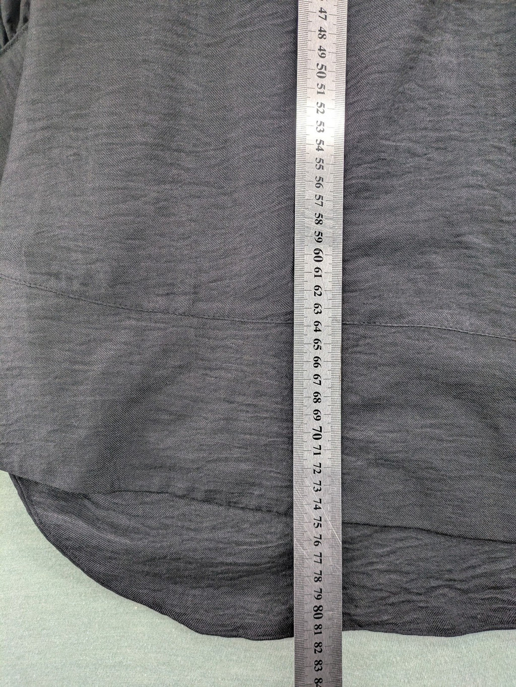 Damen grey turtle neck jumper with balloon sleeves and side ties, high-low hem.