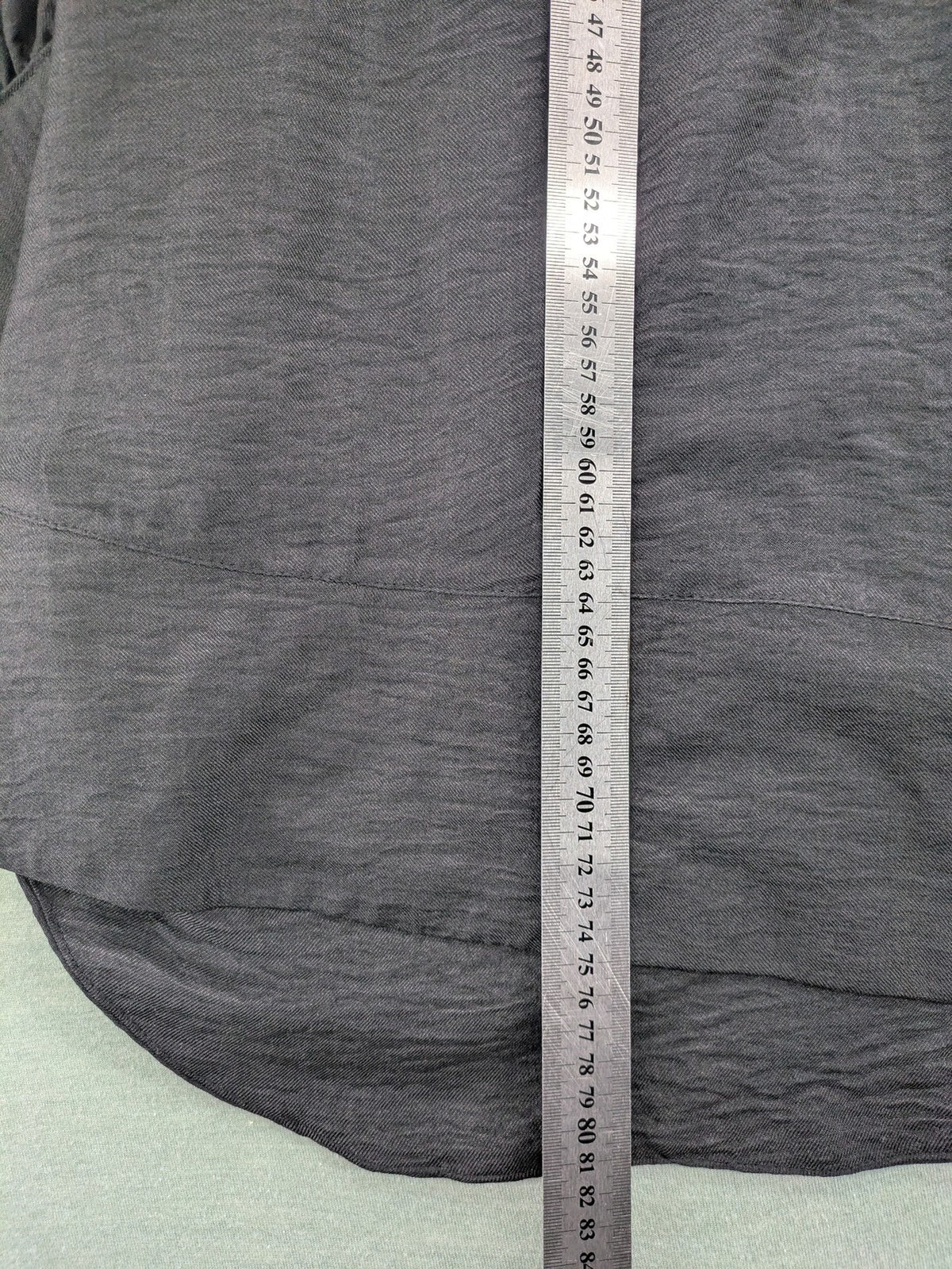 Damen grey turtle neck jumper with balloon sleeves and side ties, high-low hem.