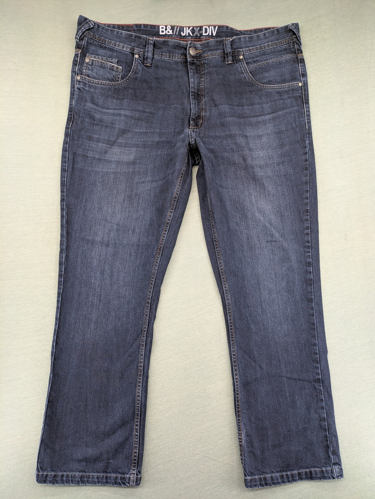 Canda blue straight jeans with five-pocket design and dark wash denim.