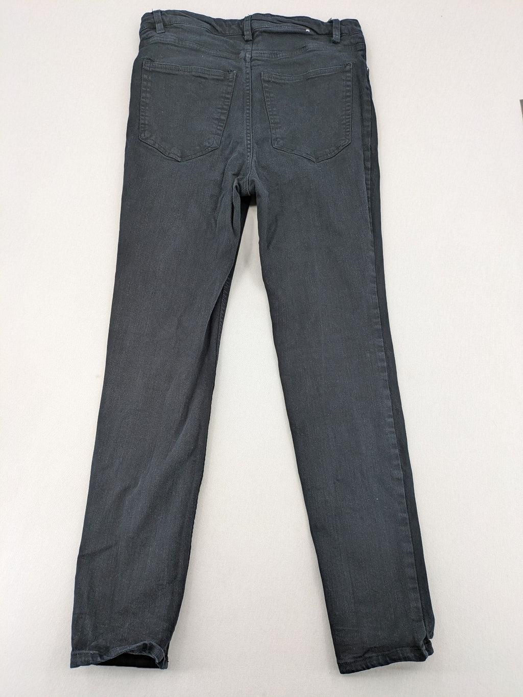 H&M grey skinny jeans with faded wash and soft stretch denim material.