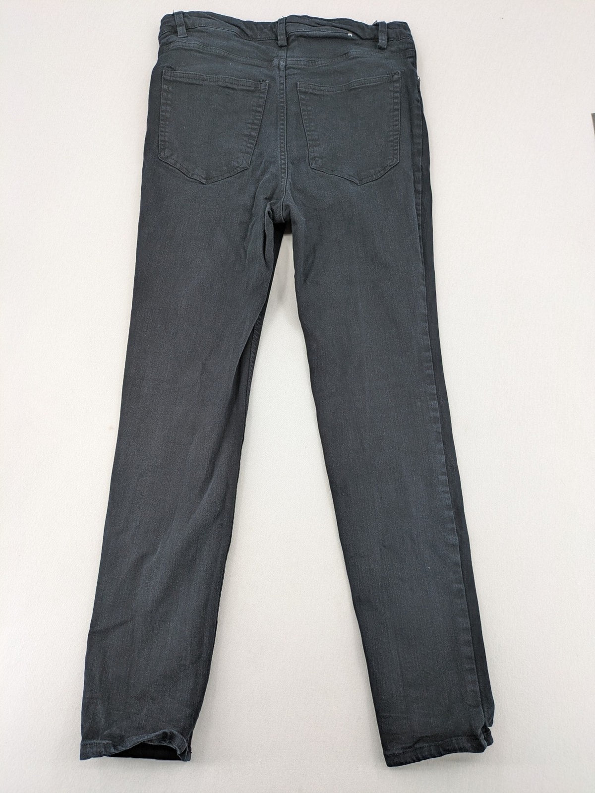 H&M grey skinny jeans with faded wash and soft stretch denim material.