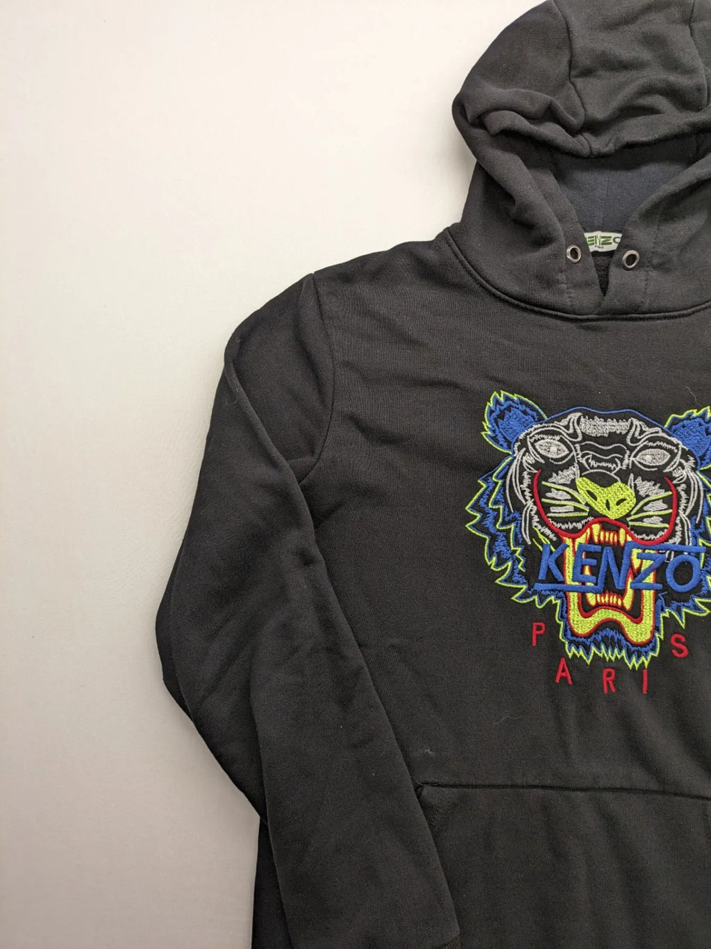 Kenzo multi hoodie with embroidered tiger graphic, drawstring hood, and kangaroo pocket.