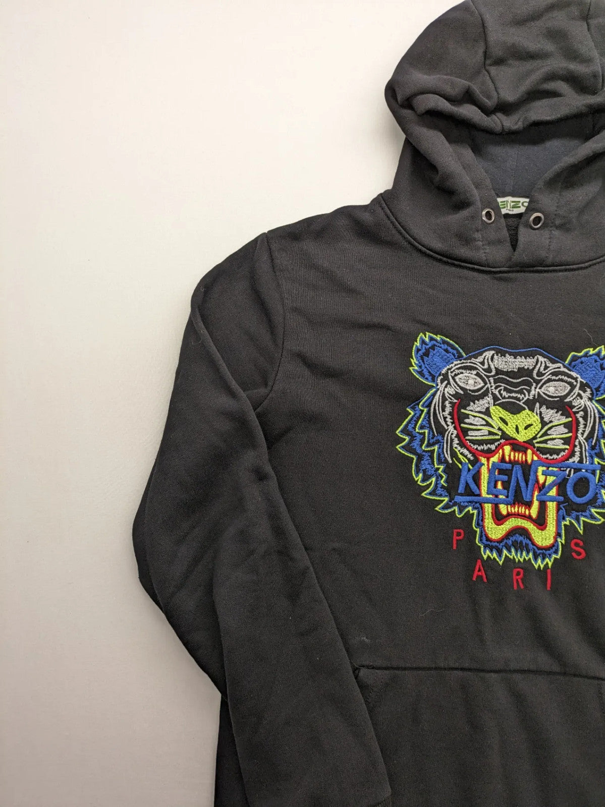 Kenzo multi hoodie with embroidered tiger graphic, drawstring hood, and kangaroo pocket.