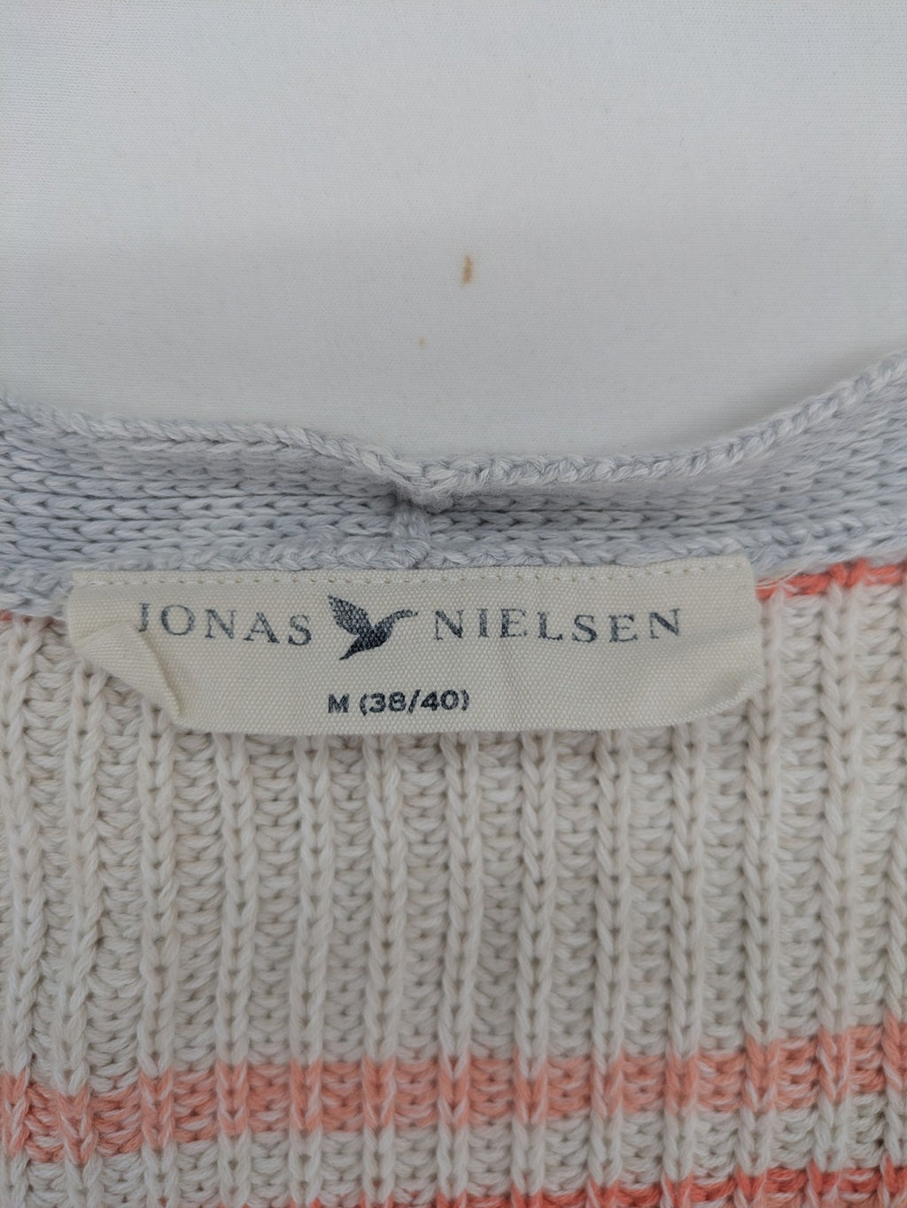 Jonas multi turtle neck jumper with striped pattern and open front design.
