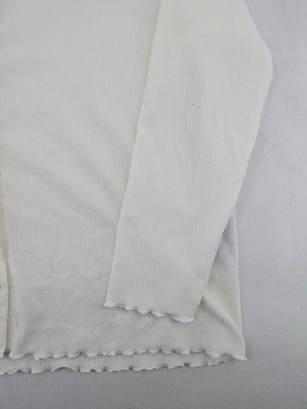 C&A cream blouse XXL textured crinkle fabric with gold button placket and wavy hem.
