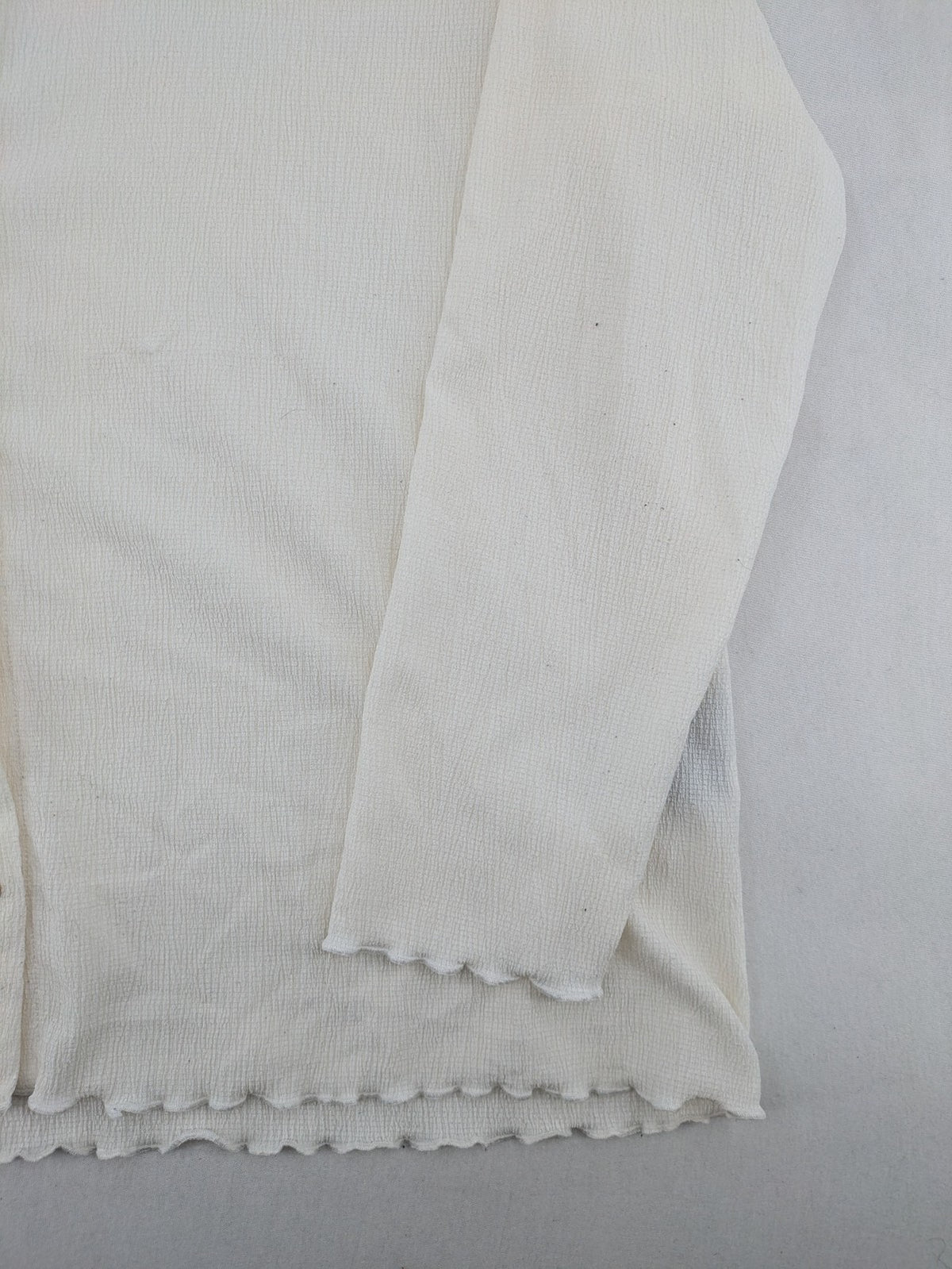 C&A cream blouse XXL textured crinkle fabric with gold button placket and wavy hem.