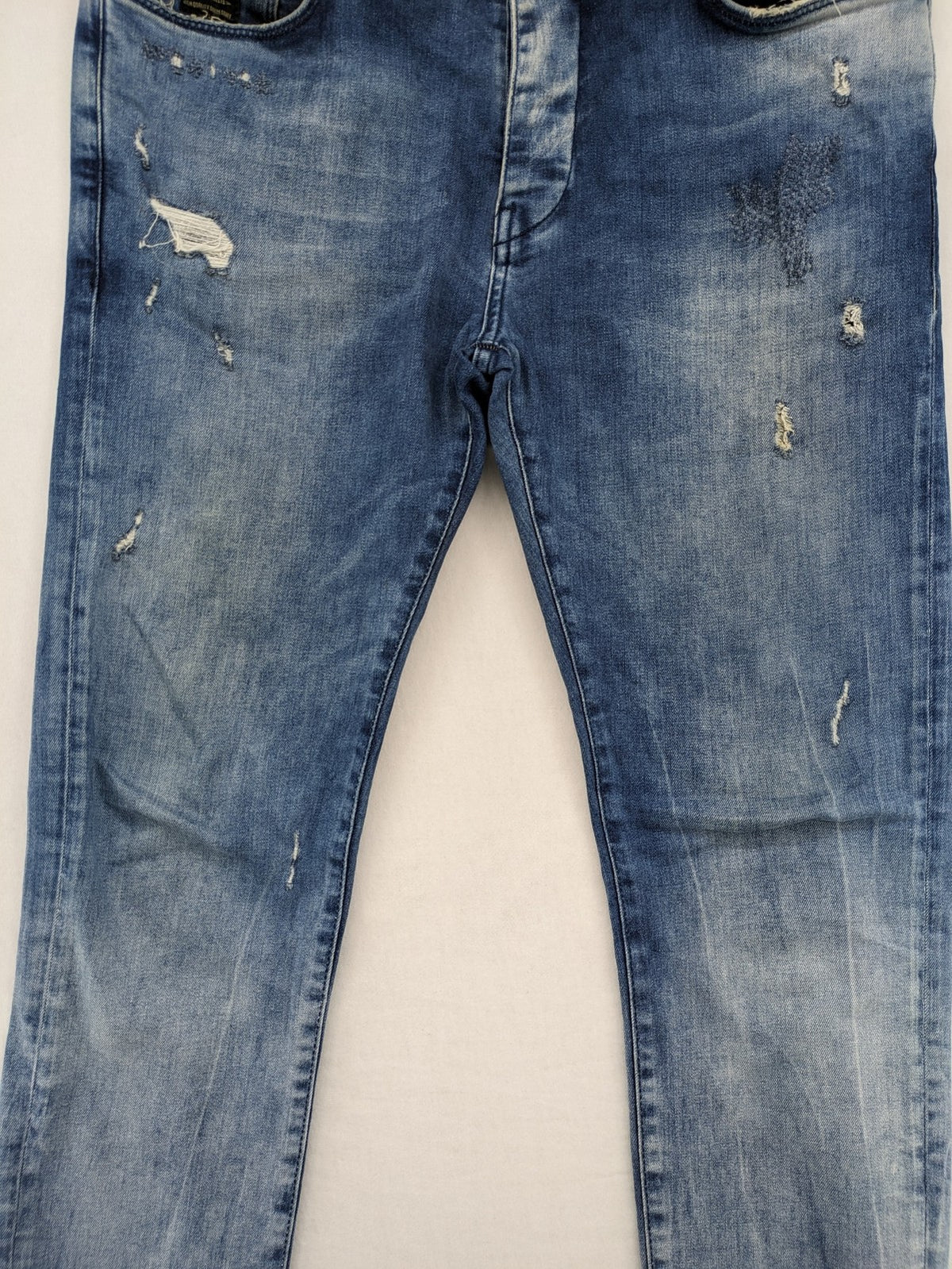 W32 blue straight jeans distressed details tapered fit button fly design