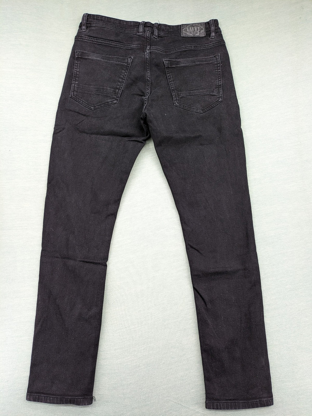 Savvy black straight jeans with washed finish and slim fit, made from stretch denim.