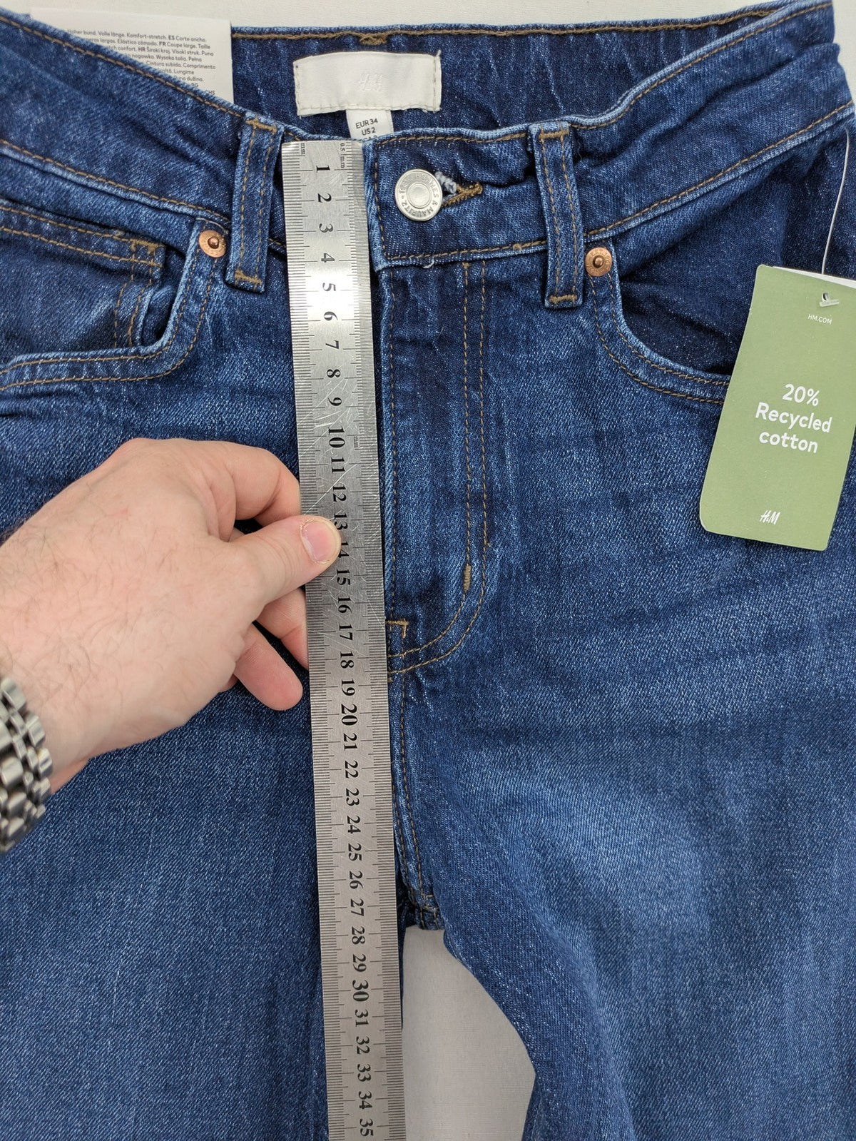 H&M blue wide leg high waist jeans with classic 5-pocket design and stretch denim.