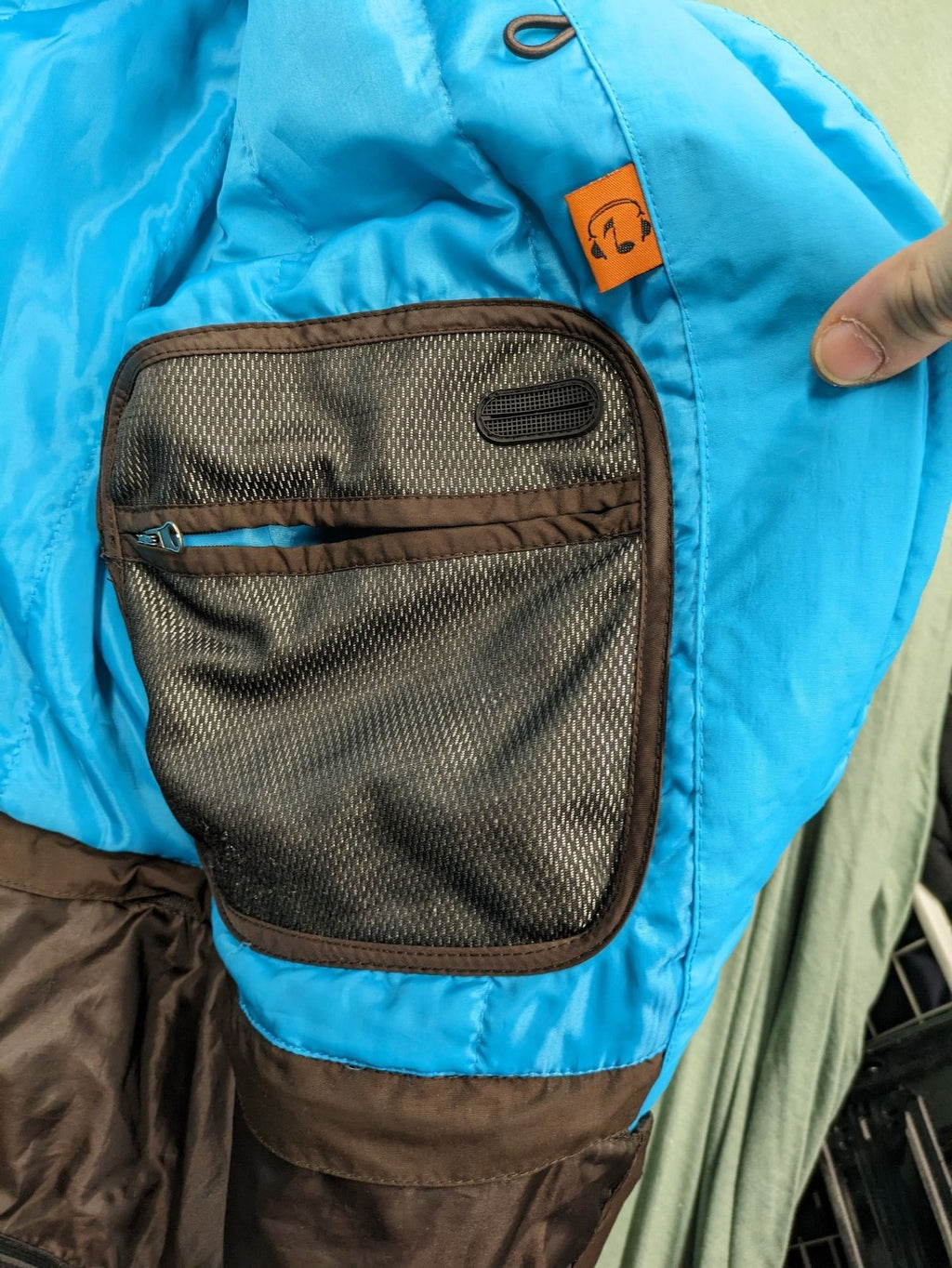 Thinsulate black and blue ski jumpsuit with hood and zippered pockets.