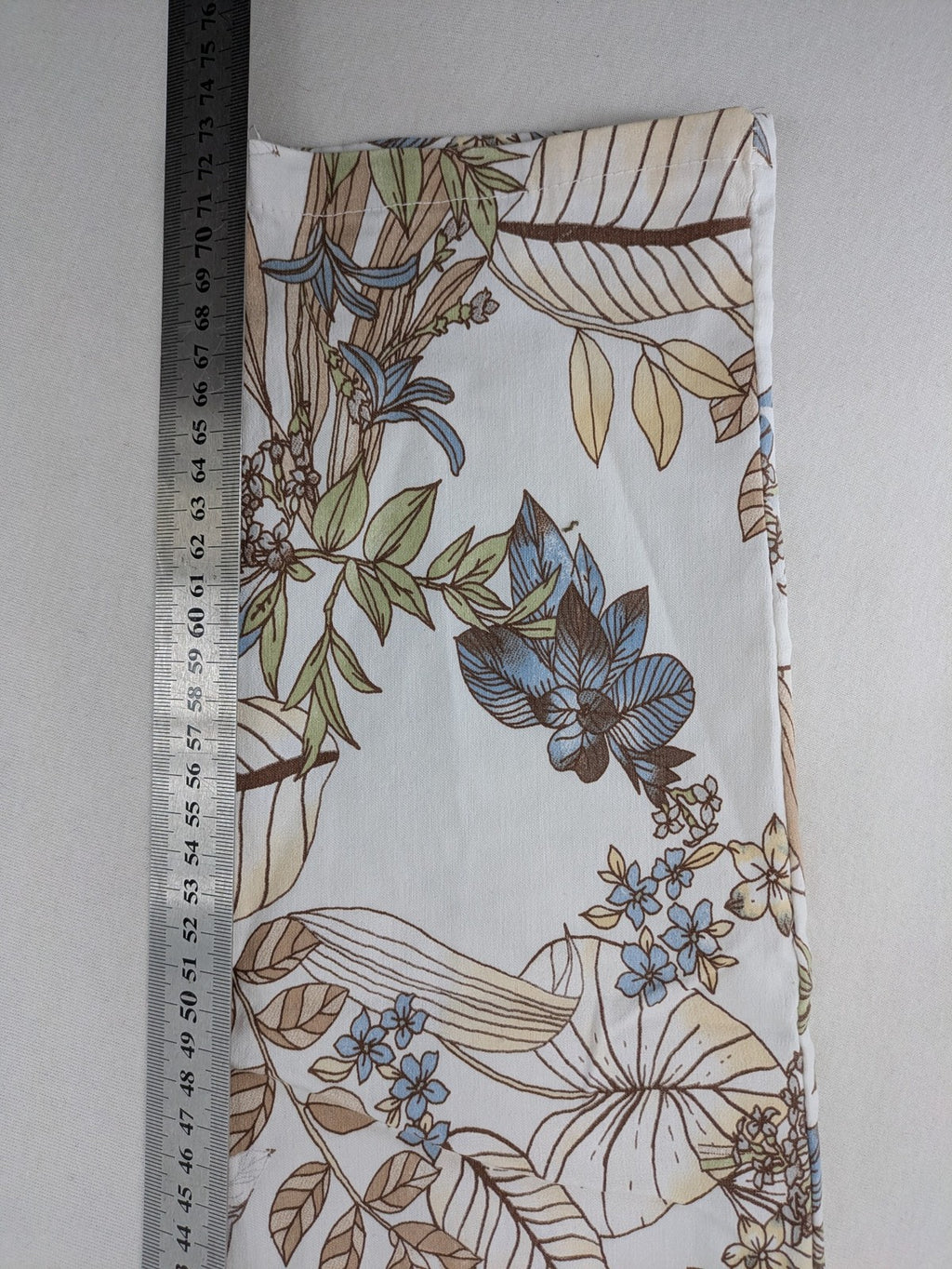 Made in Italy multi pants tropical floral pattern cotton-viscose blend on white background.