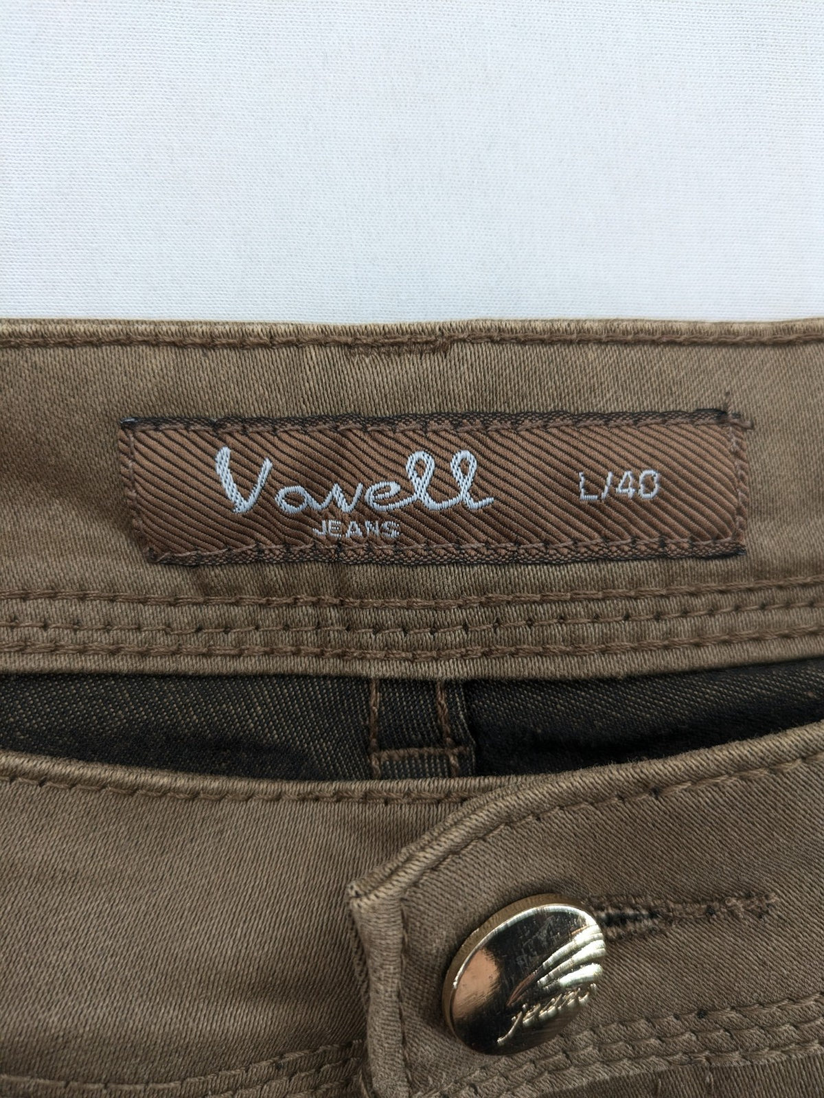 Vavell khaki skinny jeans five-pocket design with unique front zipper detail.