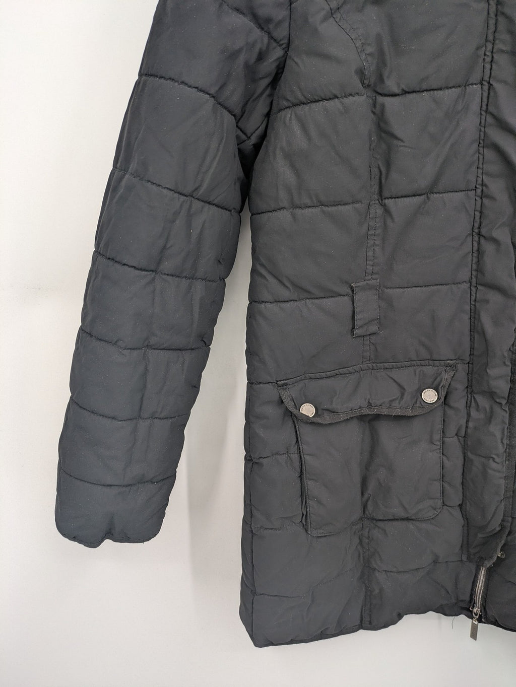 Mark Adam grey quilted jacket with high collar and buttoned flap pockets.