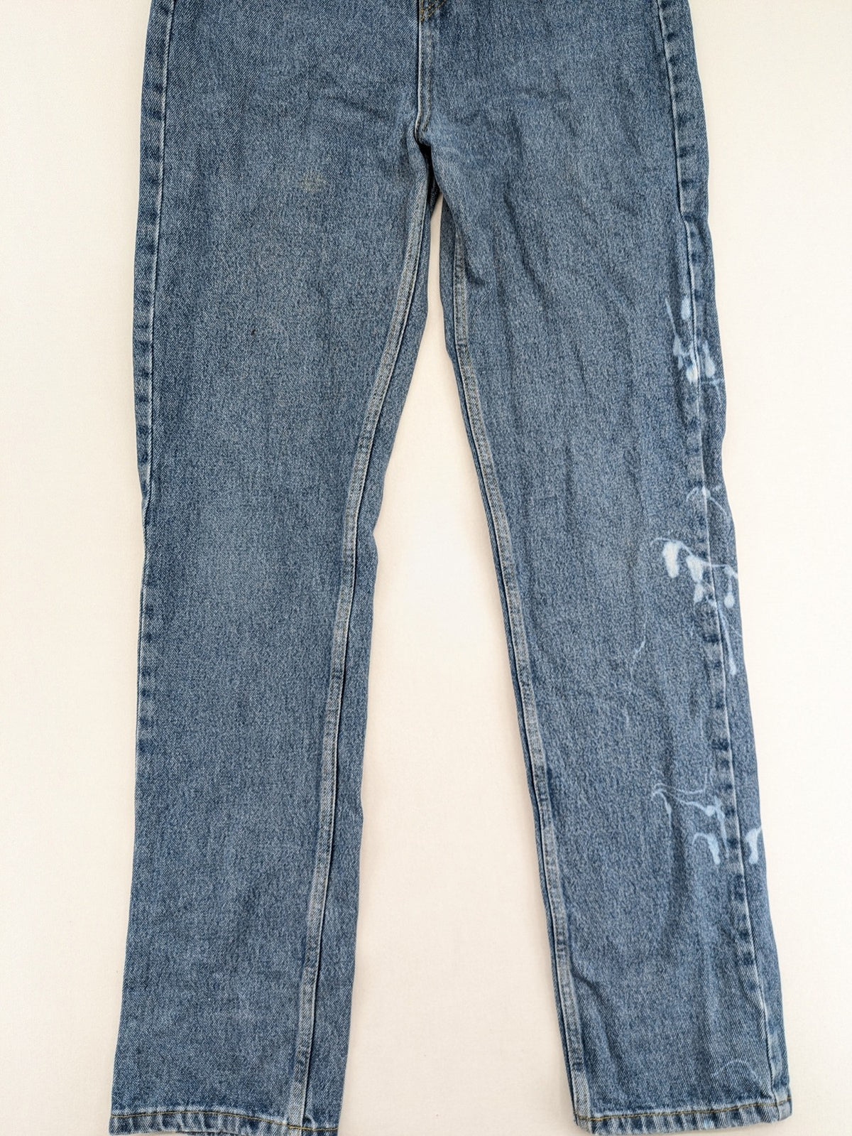Castro Jeans blue straight leg jeans high waist with white paint splatter details.