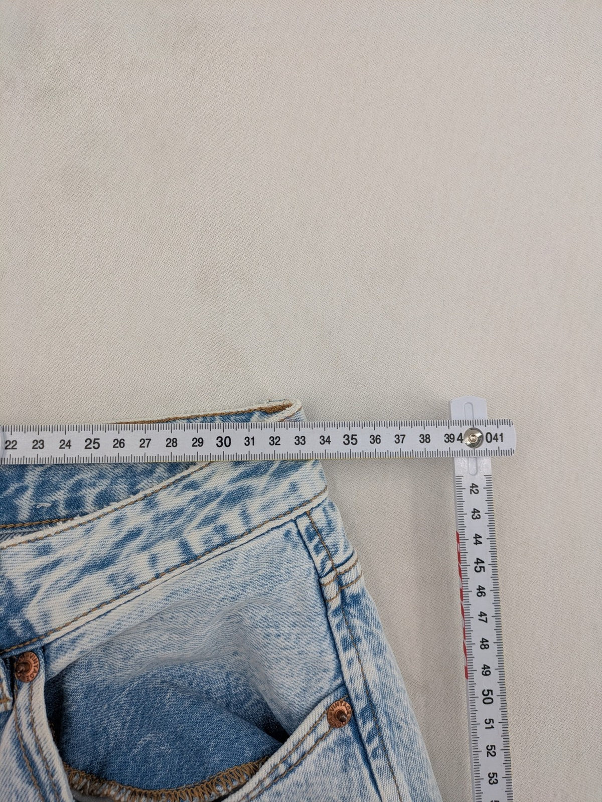 Stradivarius blue high waist flare jeans with acid wash and classic five-pocket design.