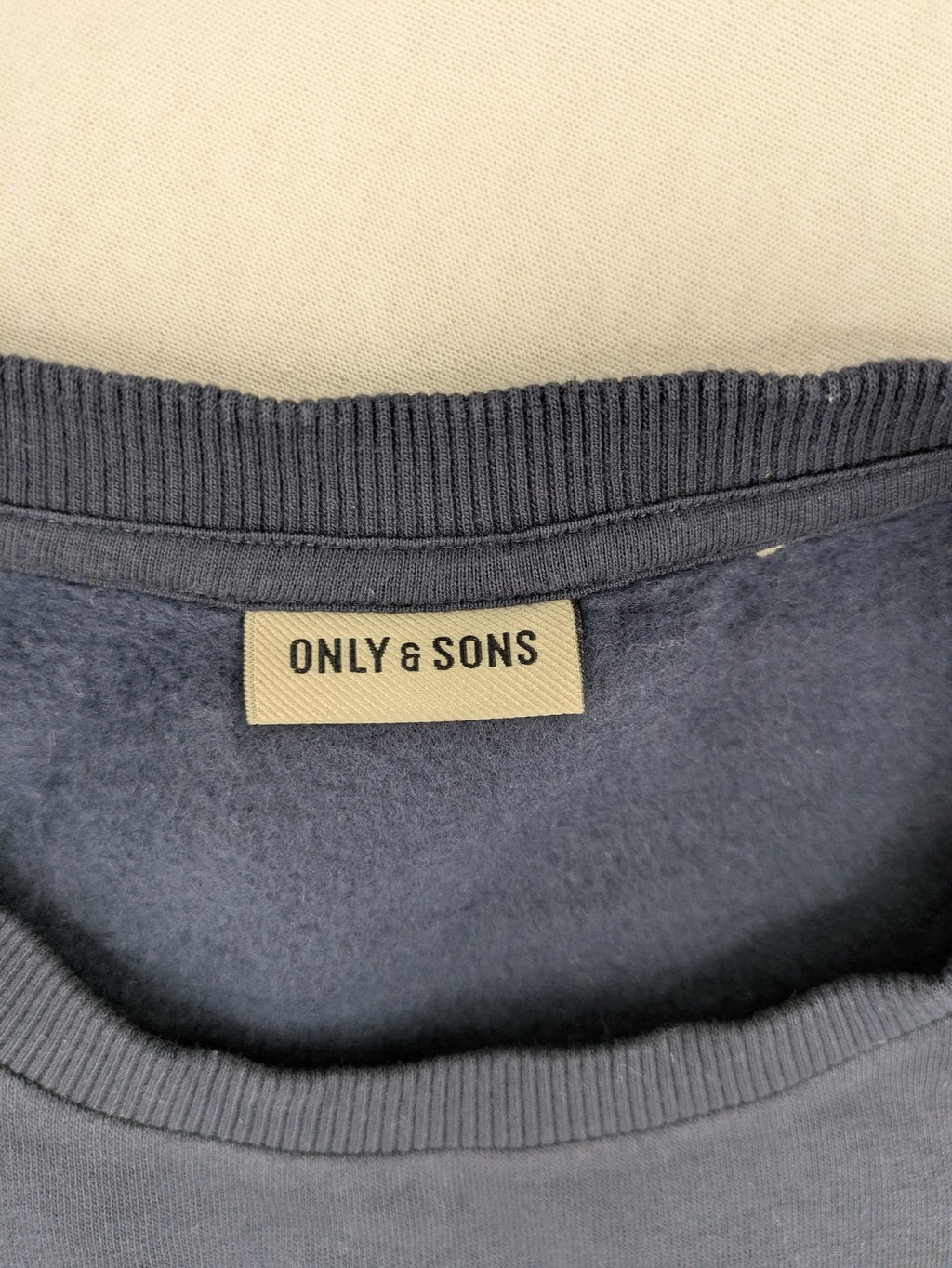 G-Unit navy turtle neck jumper with vertical logo graphic and soft fleece interior.