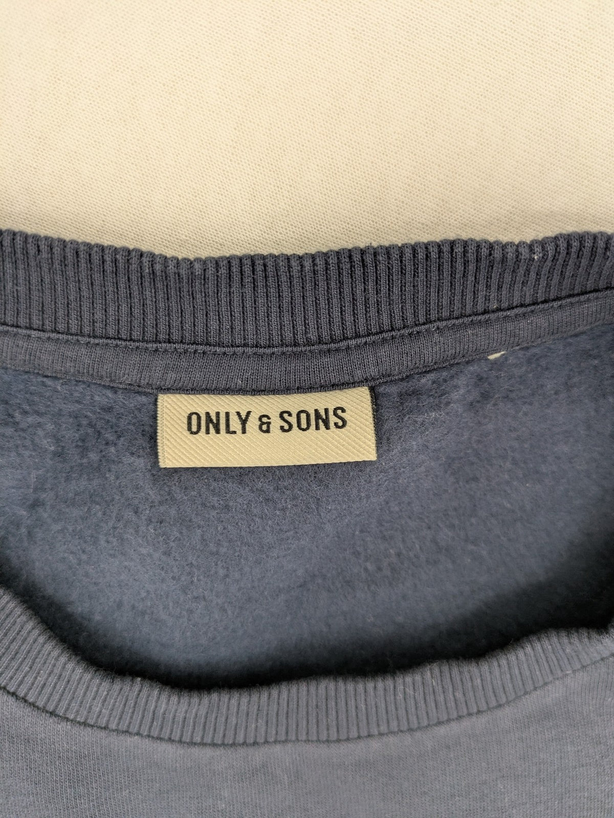 G-Unit navy turtle neck jumper with vertical logo graphic and soft fleece interior.