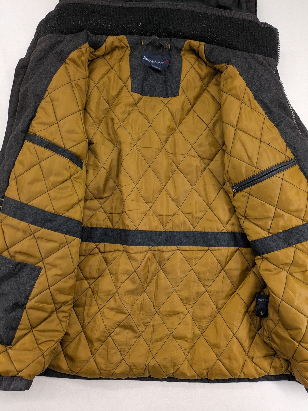 Rover & Lakes grey jacket with hood, quilted lining, and multiple pockets.