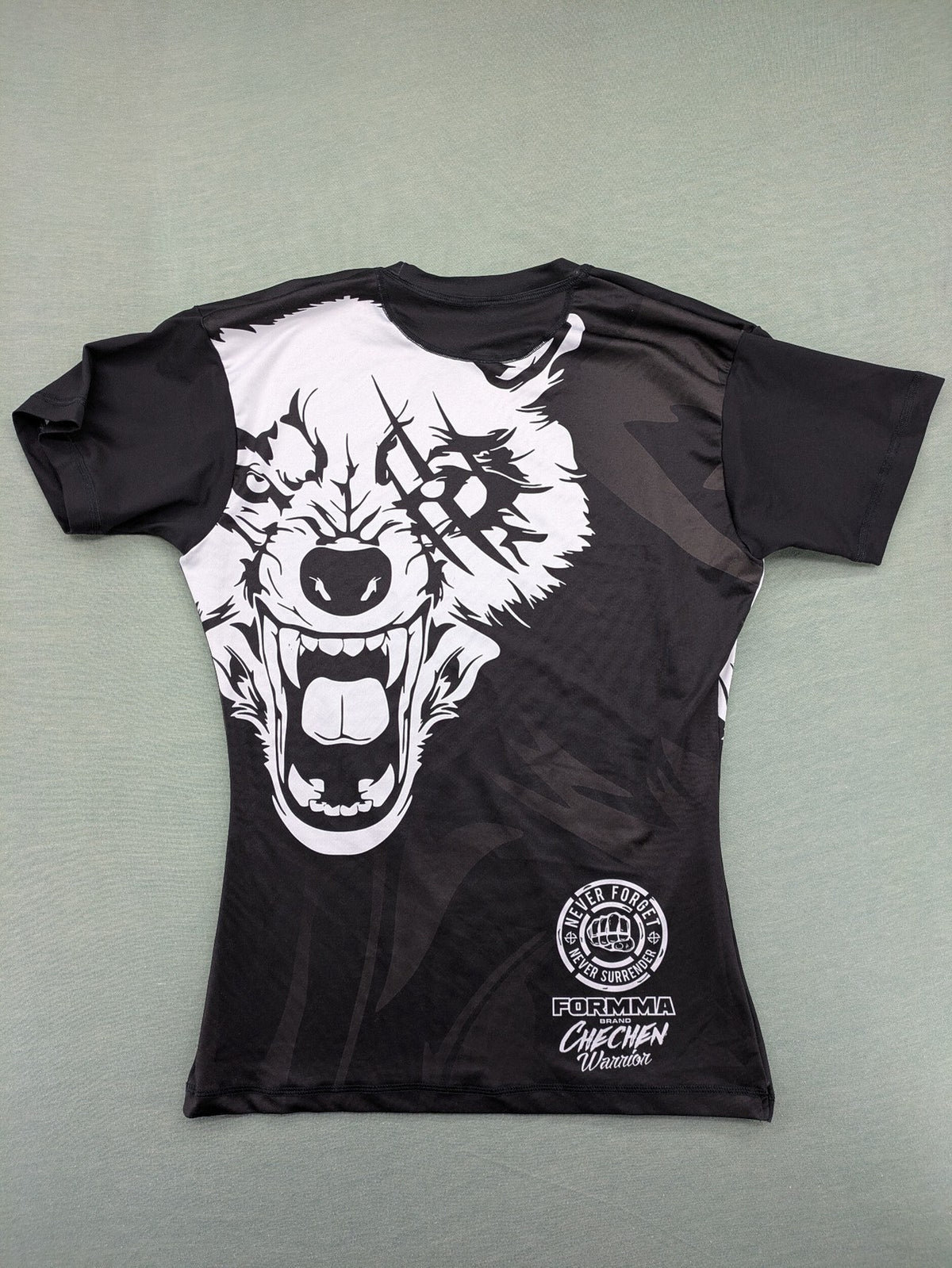 FORMMMA black rashguard featuring striking white wolf graphic and "Chechen Warrior" text.