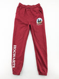 Harry Potter burgundy sweatpants featuring "HOGWARTS" print and Chibi graphic of Harry, Ron, Hermione.