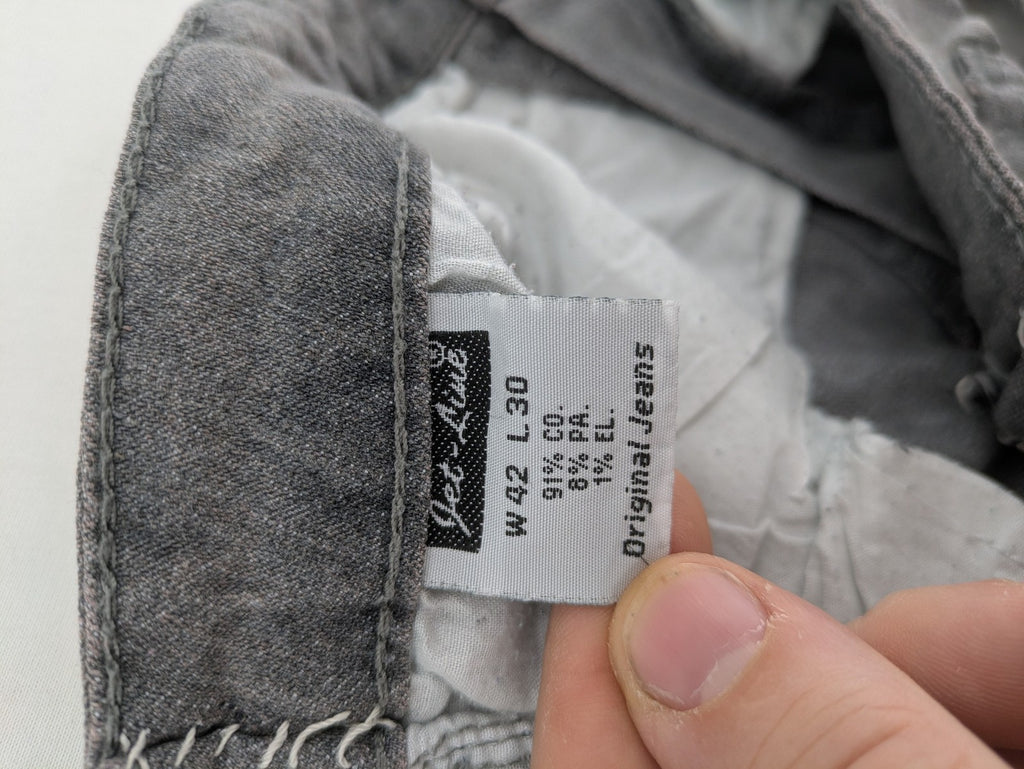 Jet Line grey straight jeans with embellished back pockets and frayed hem details.